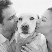 Couple Kissing Dog